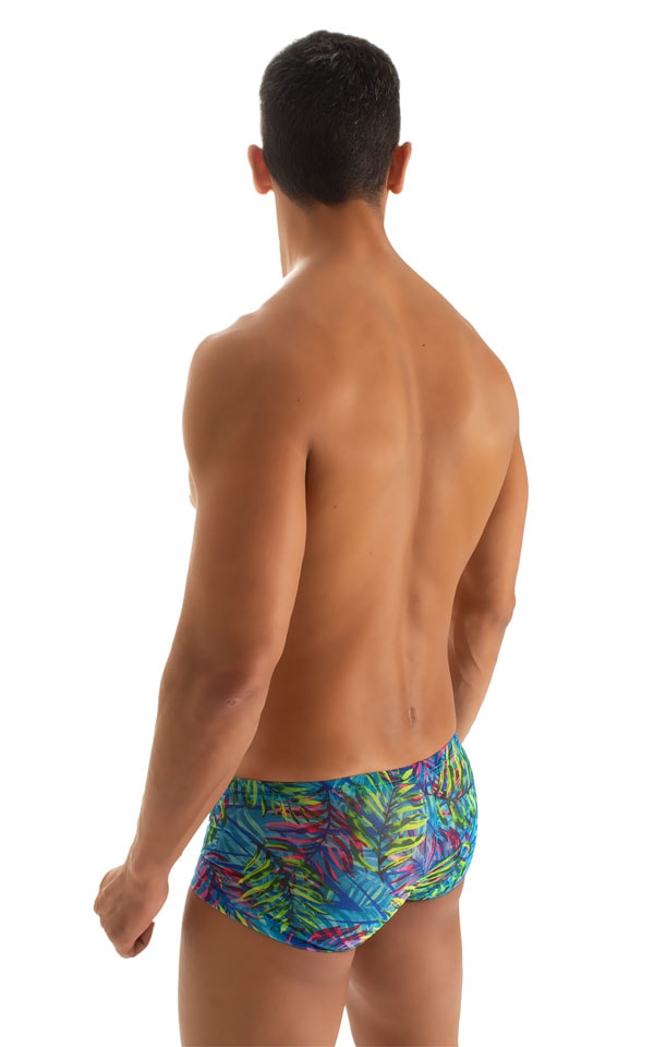 Extreme Low Square Cut Swim Trunks in Tan Through Neon Ferns, Rear View