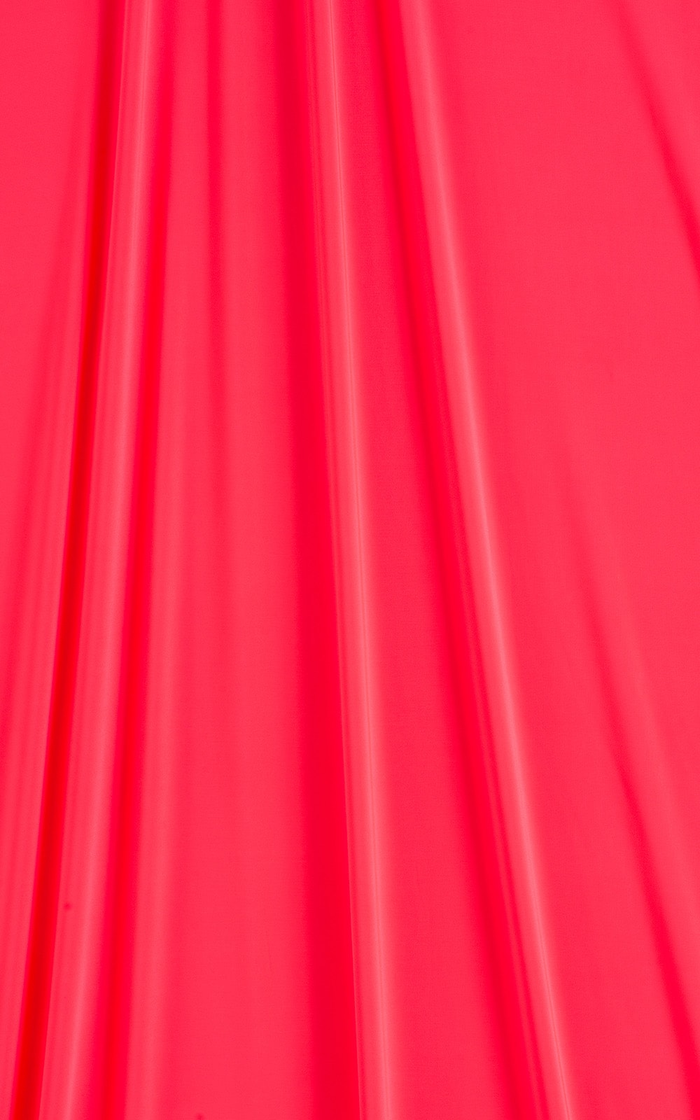 solid color light weight neon coral slinky and silky stretch swimwear fabric