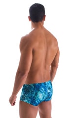 Extreme Low Square Cut Swim Trunks in Deep Glacier, Rear View